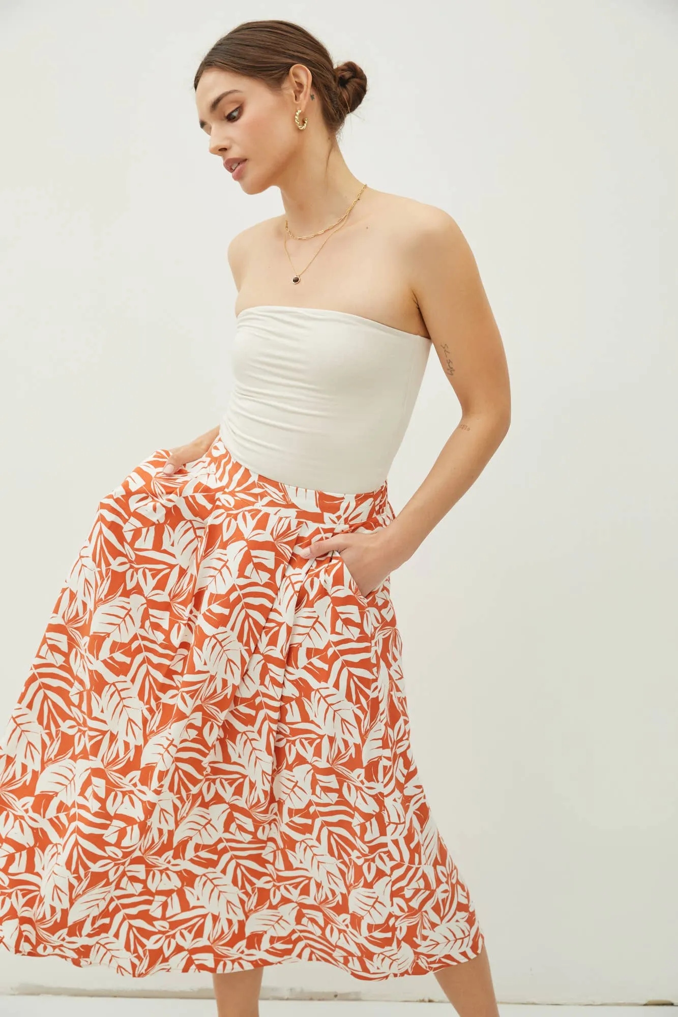 TROPICAL PRINT HIGH RISE PINTUCKED MIDI SKIRT